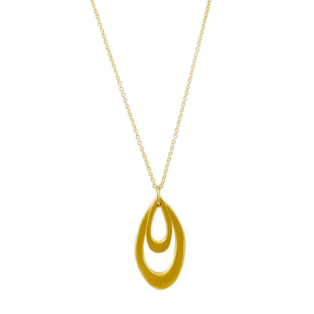 Gold necklace with a teardrop-shaped pendant on a white background