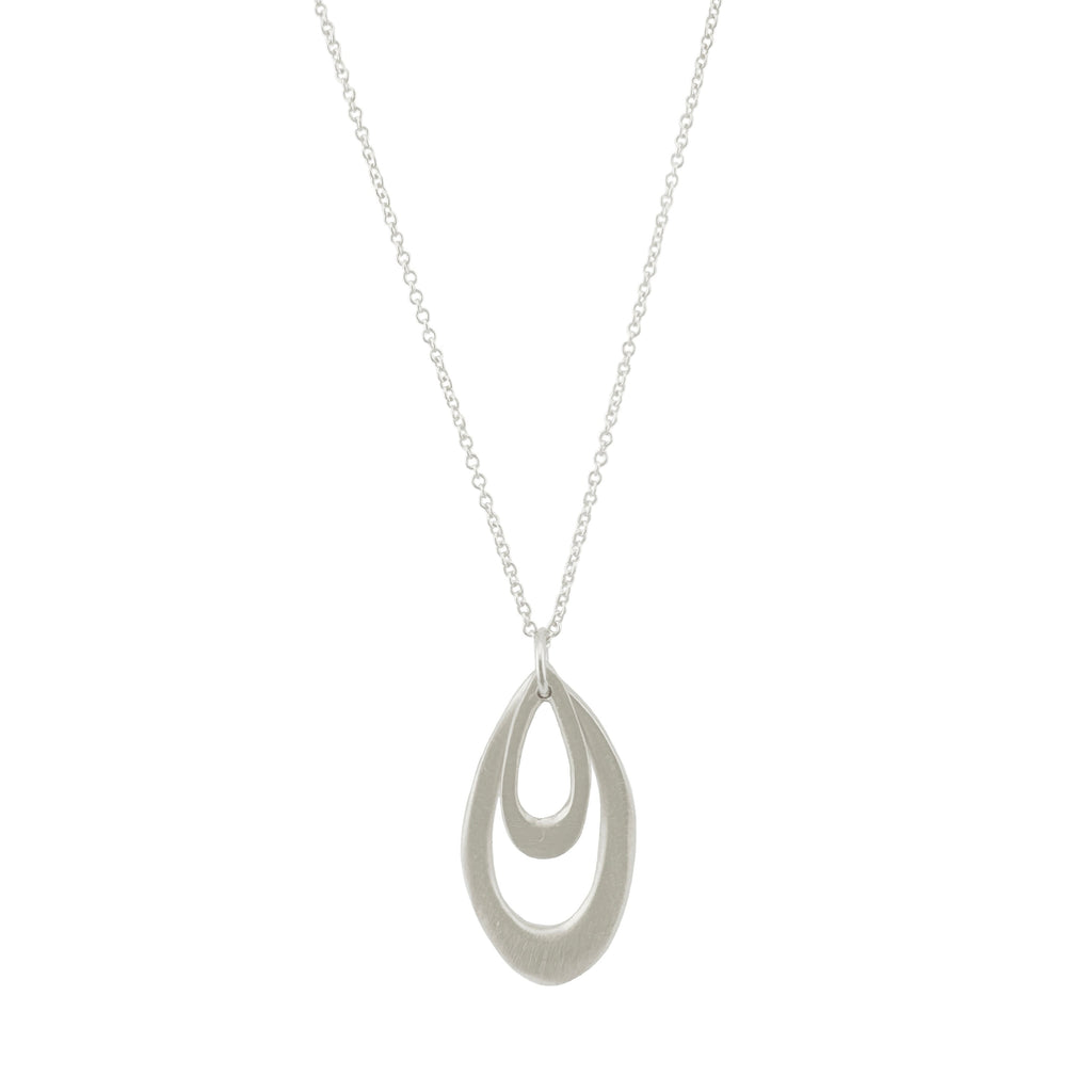 Silver necklace with a teardrop-shaped pendant on a white background