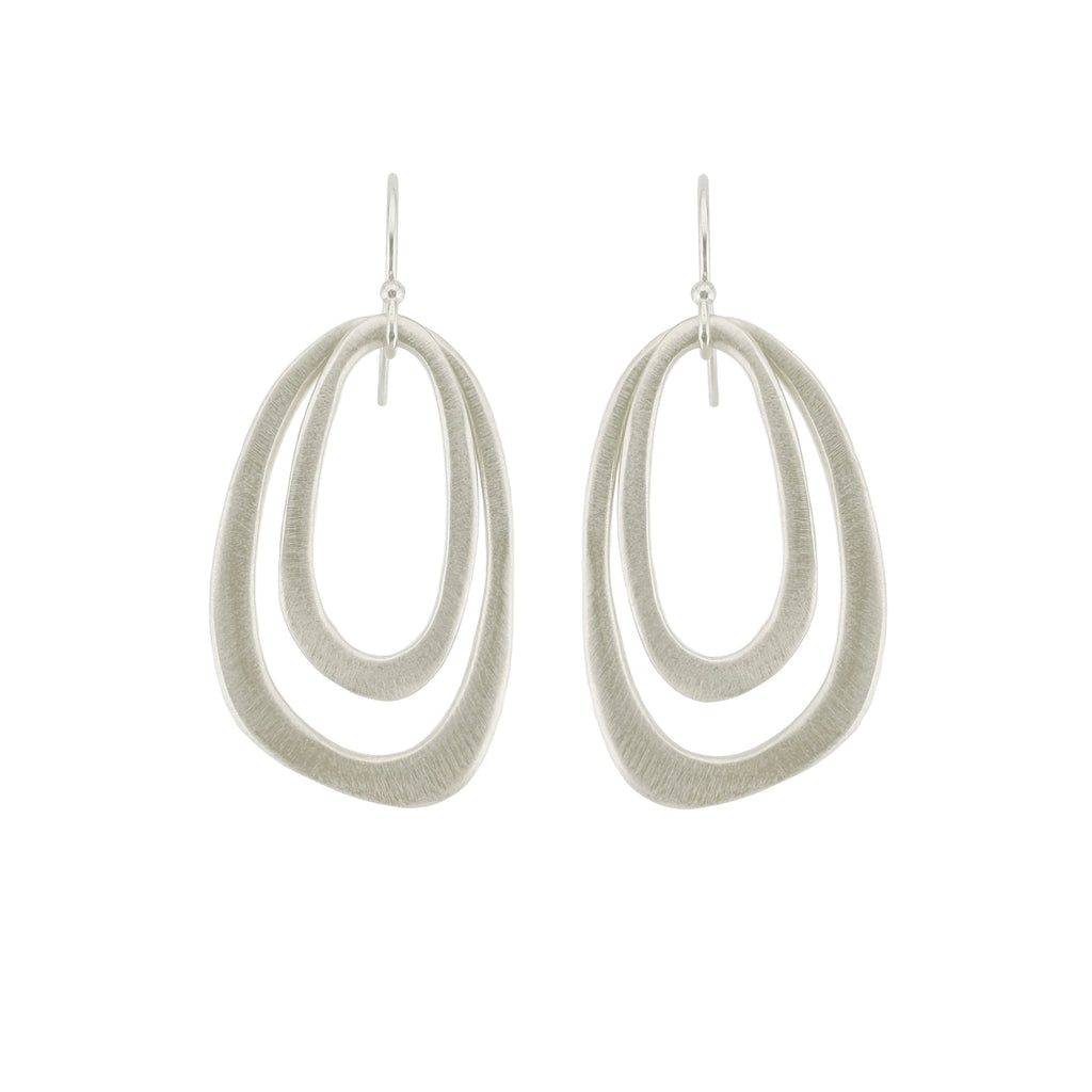 Pair of silver double hoop earrings on a white background