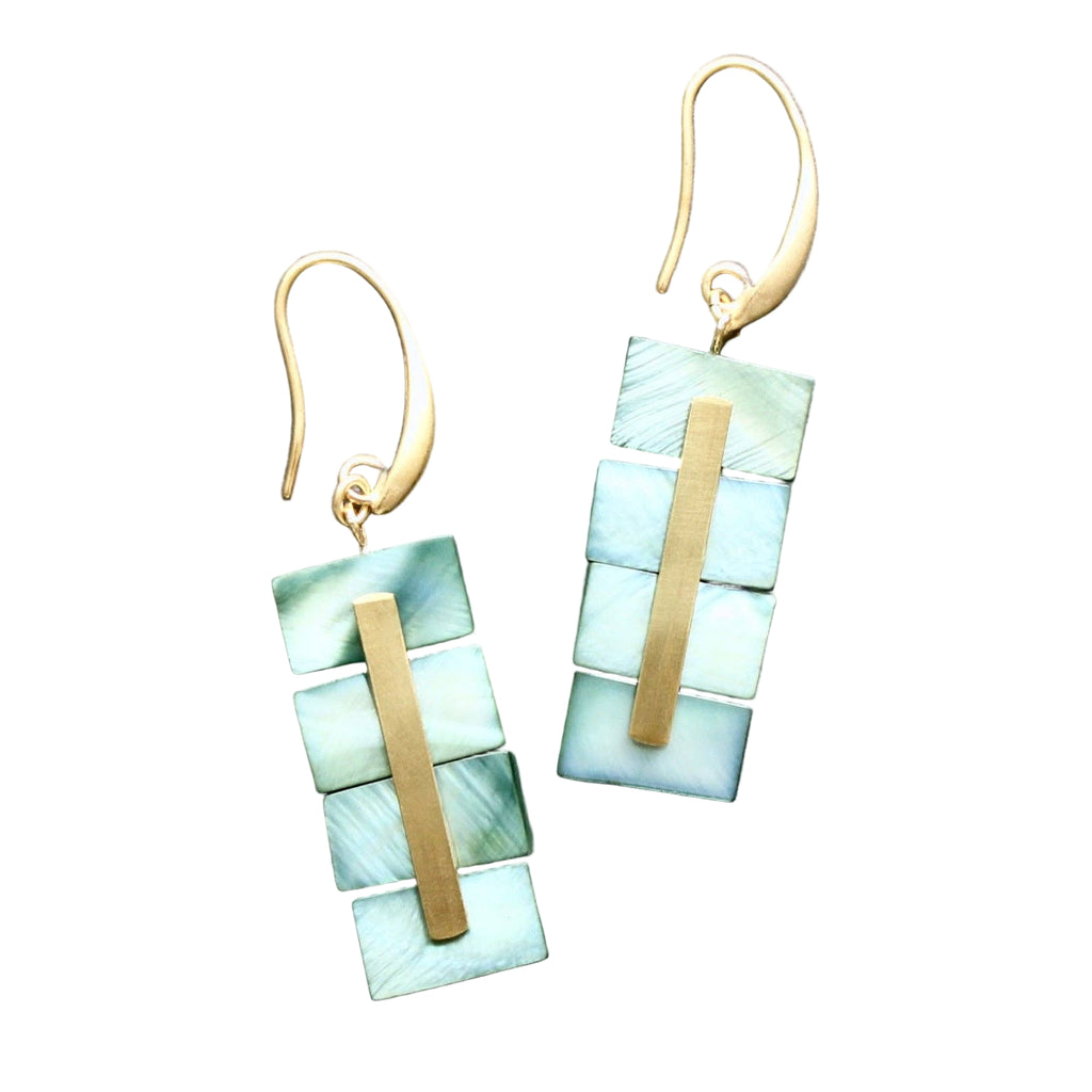Pair of earrings with green and gold geometric design on a gray background