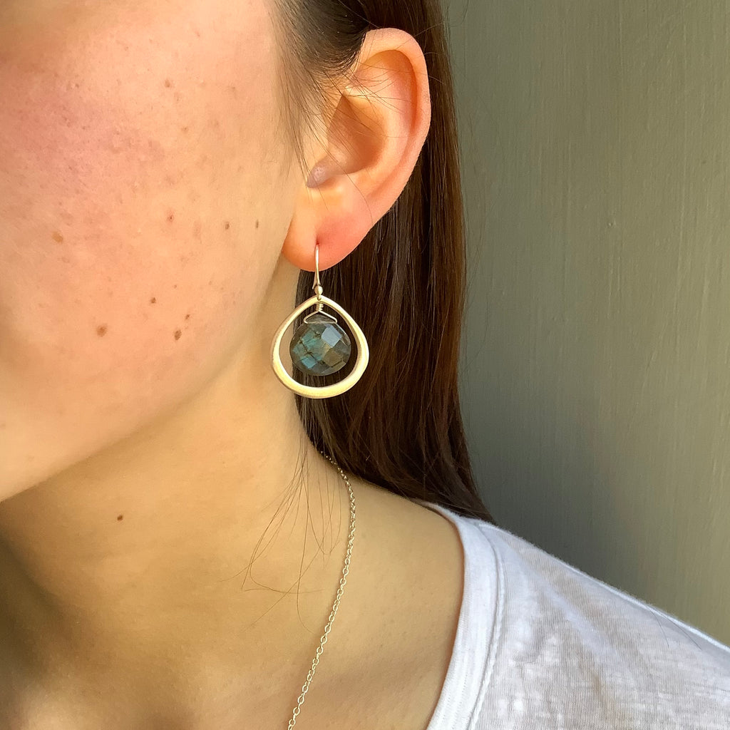 labradorite in teardrop earrings in silver on the ear