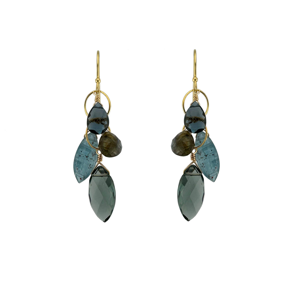 Pair of earrings with blue and green stone drops on a white background