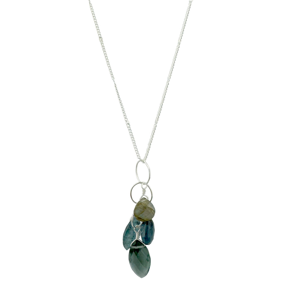 Necklace with green, blue, and grey teardrop-shaped stones on a white background