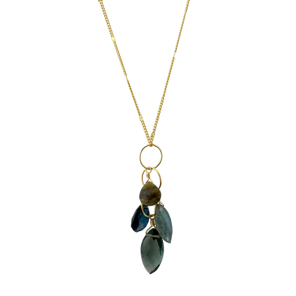 Necklace with gold chain and green leaf-shaped pendants on a white background