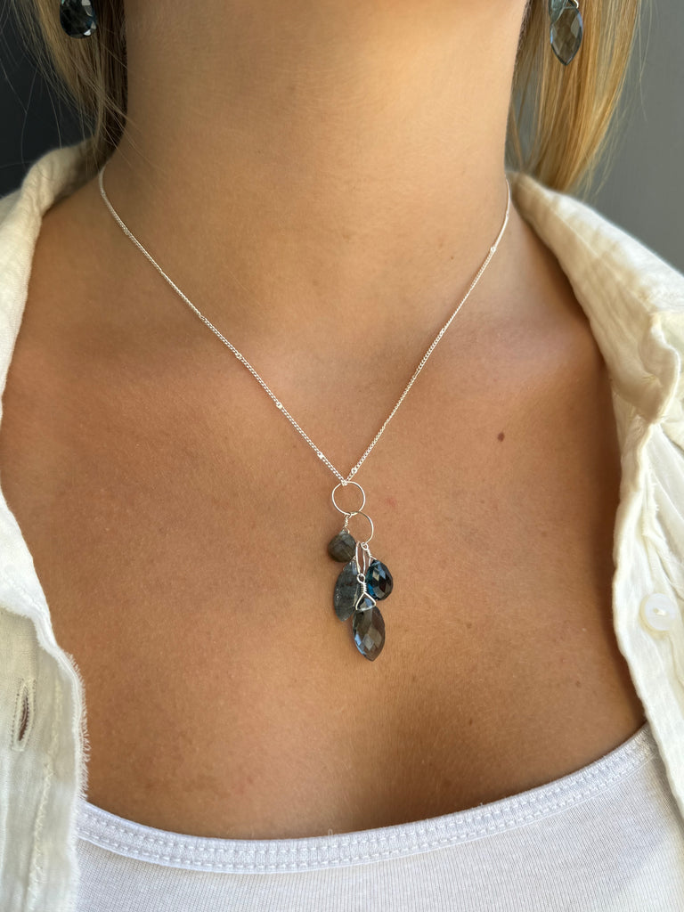 Necklace with blue stones on a person's neck