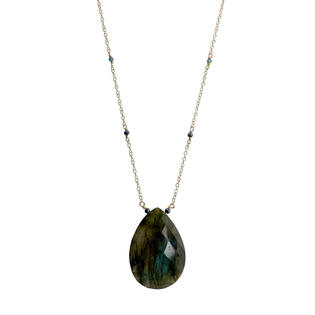 Necklace with a teardrop-shaped labradorite pendant on a white background