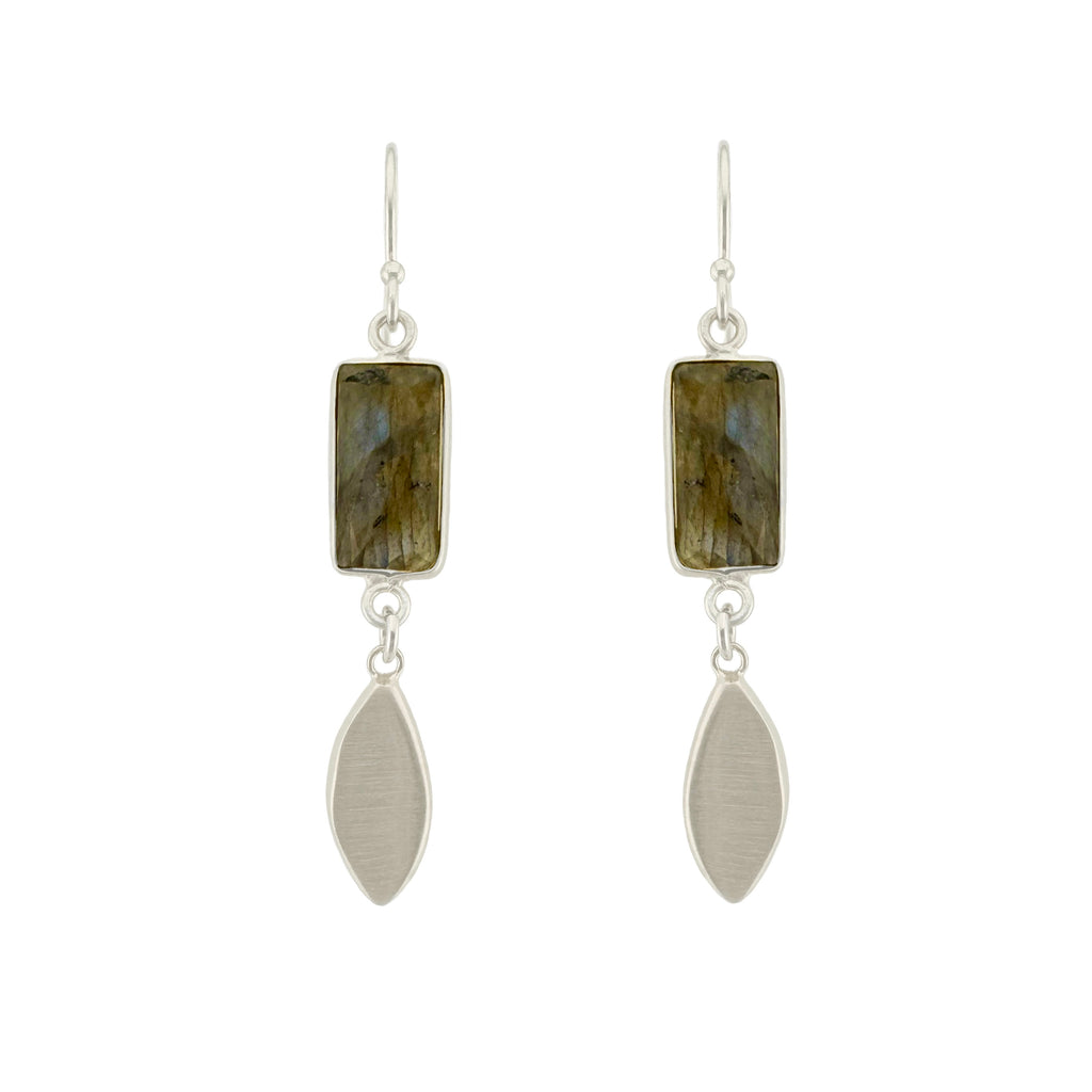 Pair of earrings with rectangular gemstones and silver leaf-shaped pendants on a white background