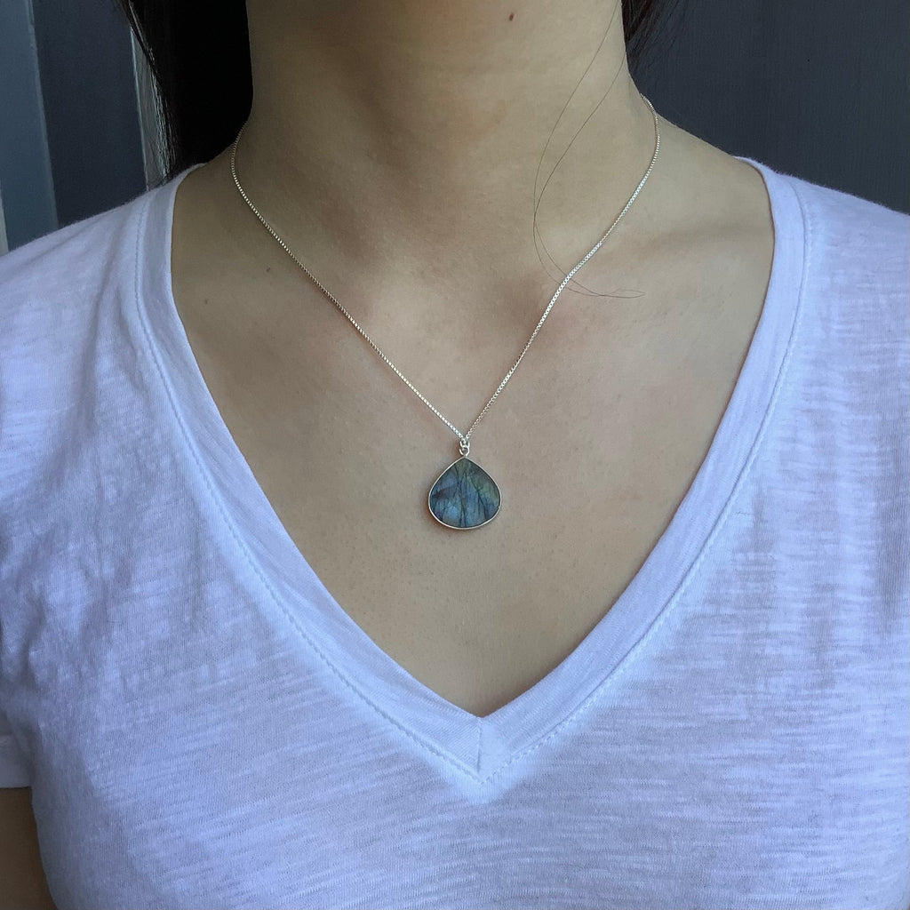 labradorite teardrop slab necklace on neck