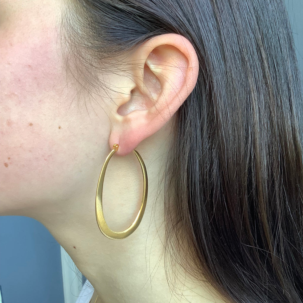 large oval hoops earrings in vermeil on the ear