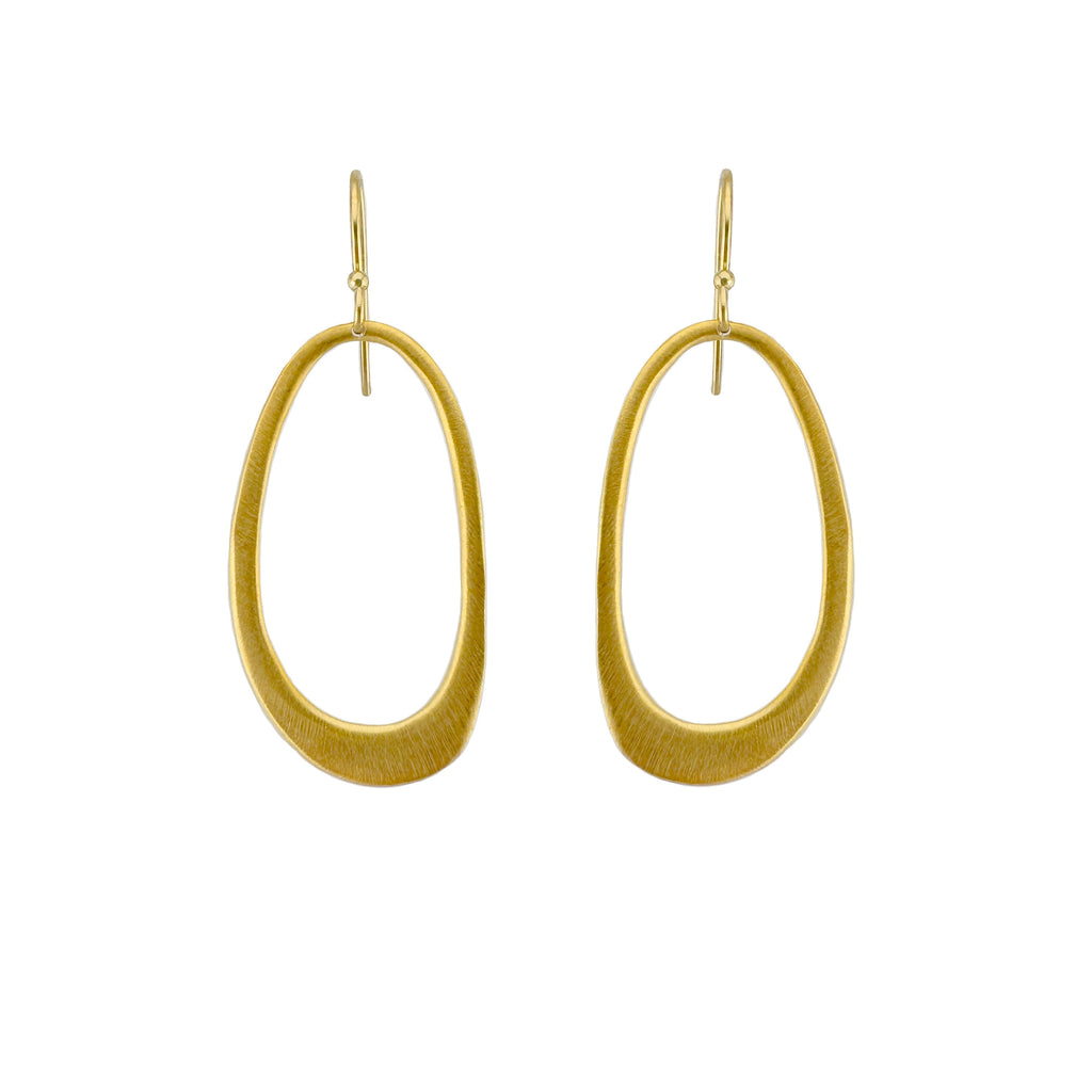 Gold hoop earrings on a white background