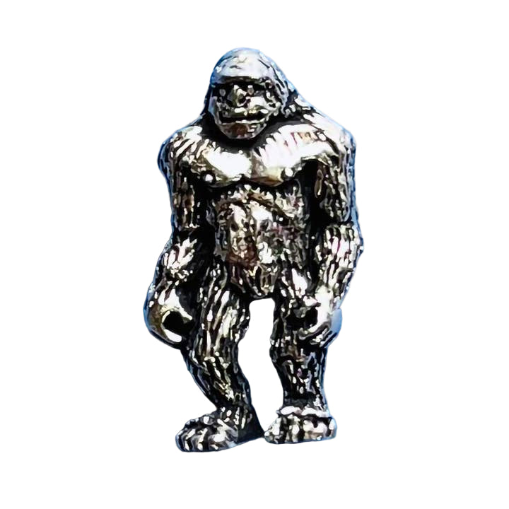 Metallic Bigfoot figurine on a blue background