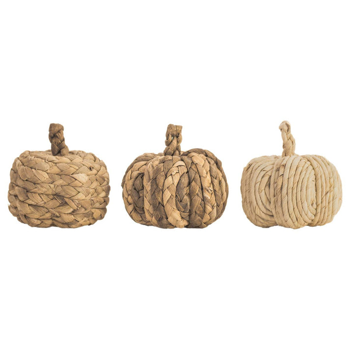 Decorative pumpkin made of braided rope on a white background