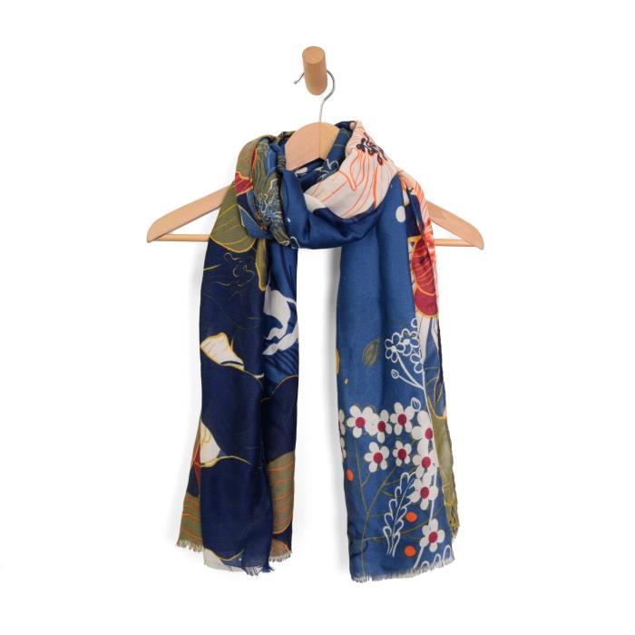 Colorful floral scarf on a wooden hanger against a white background