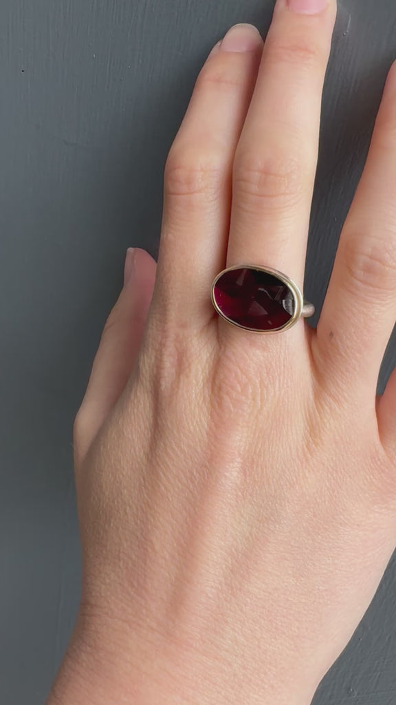 Oval Rhodalite Garnet Ring on hand