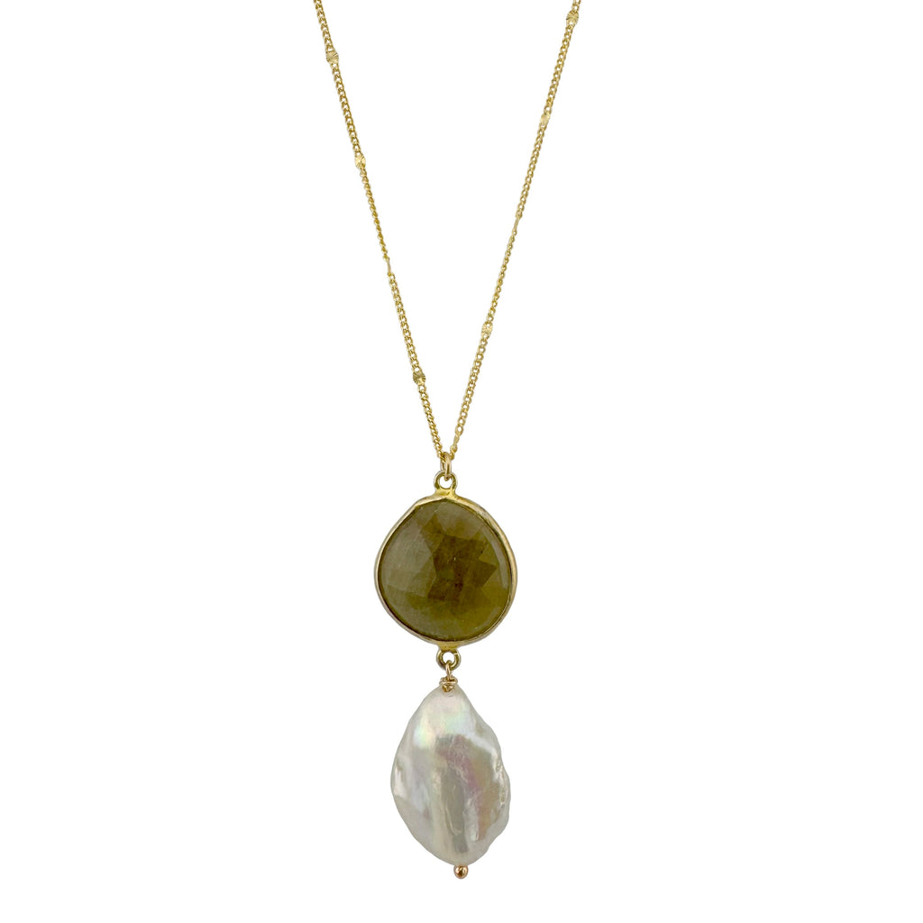 Necklace with a gold chain, yellow stone, and white pearl pendant on a white background