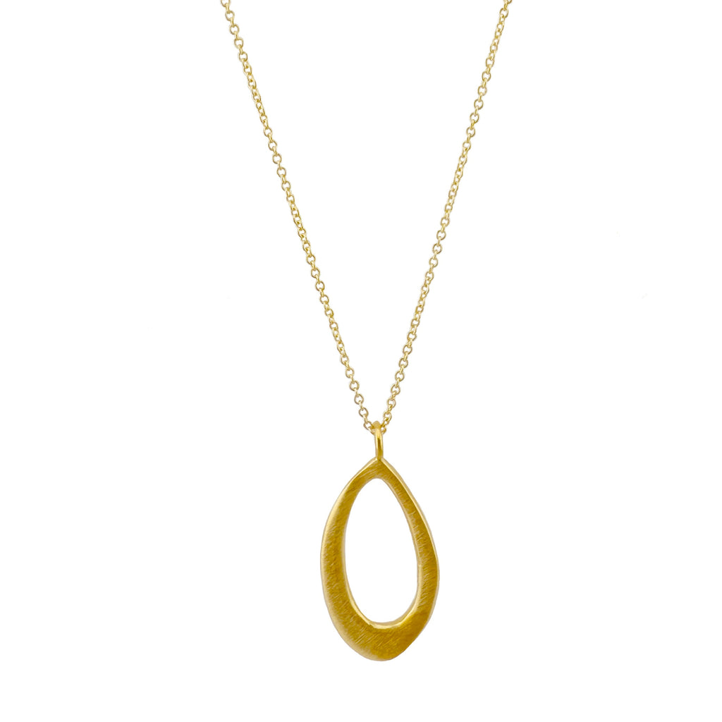Gold necklace with a teardrop-shaped pendant on a white background