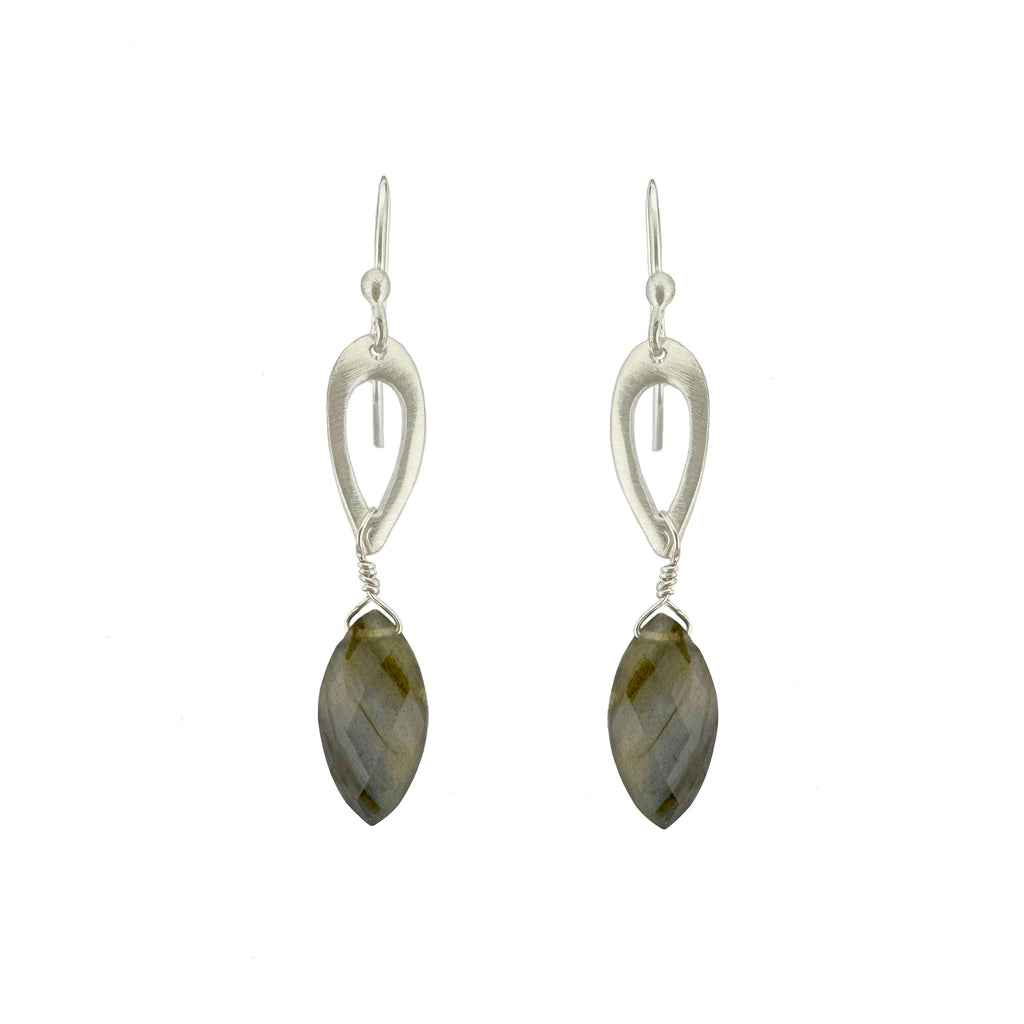 Silver earrings with marquise-shaped gemstones on a white background