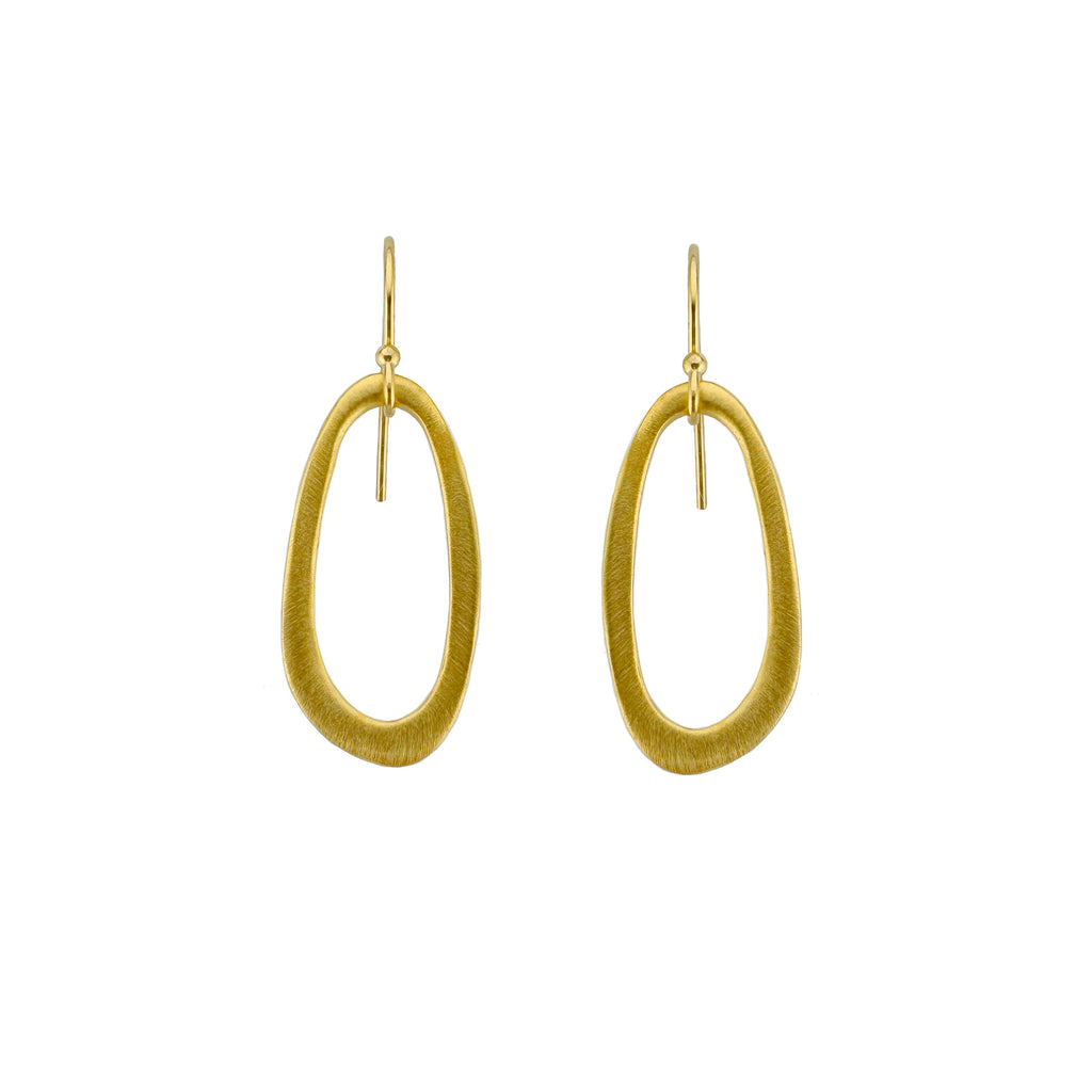 Gold hoop earrings on a white background