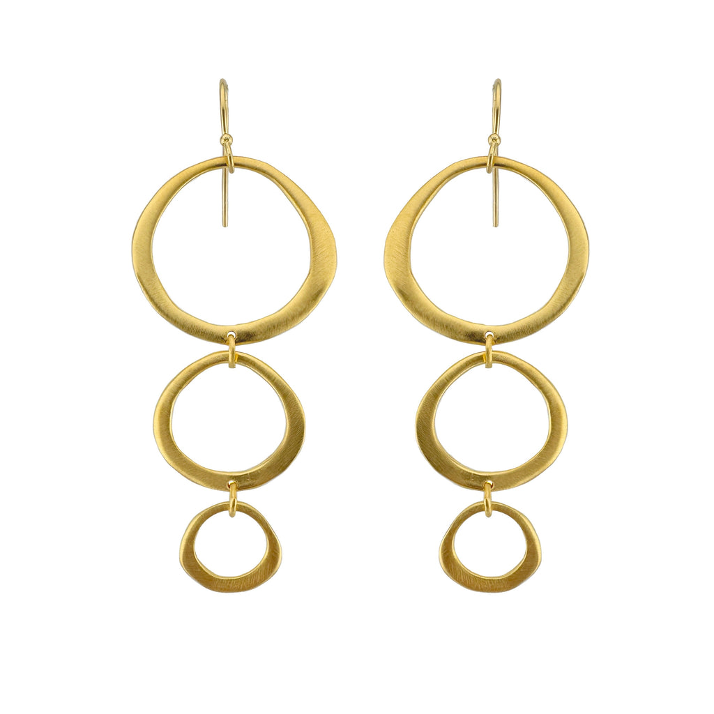 Gold hoop earrings on a white background