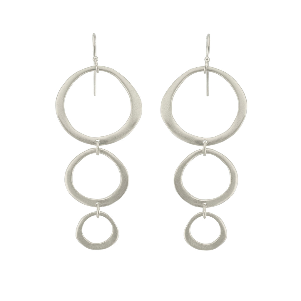 Pair of silver hoop earrings on a white background