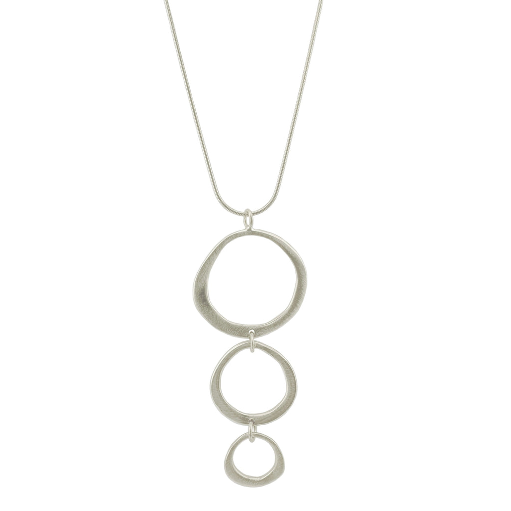 Silver necklace with three interlocking rings on a white background