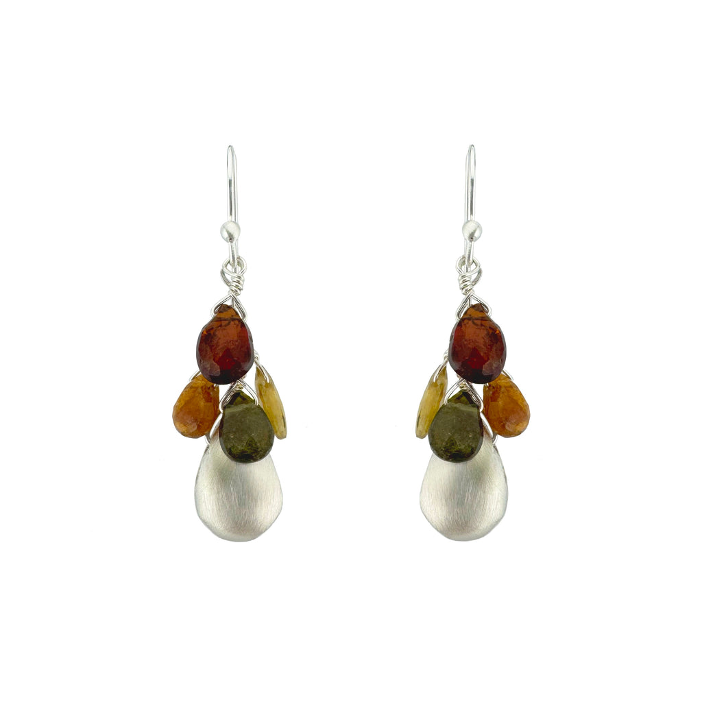 Pair of earrings with multicolored beads and silver hooks on a white background