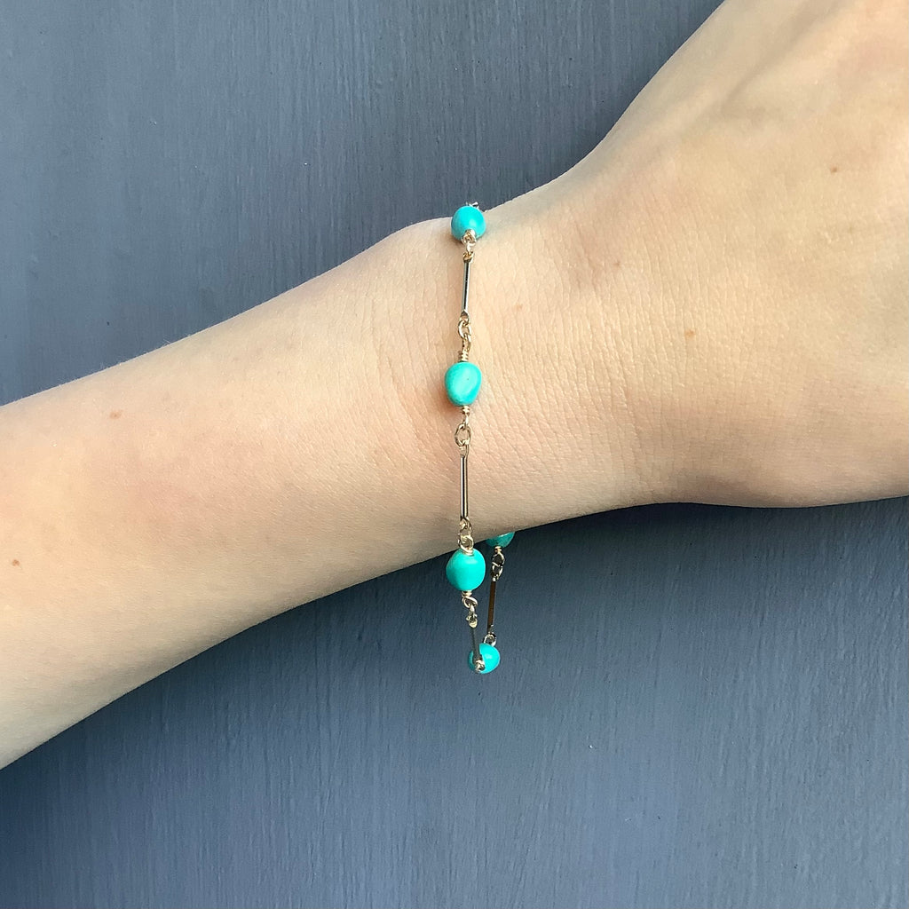 turquoise & chain bracelet on wrist