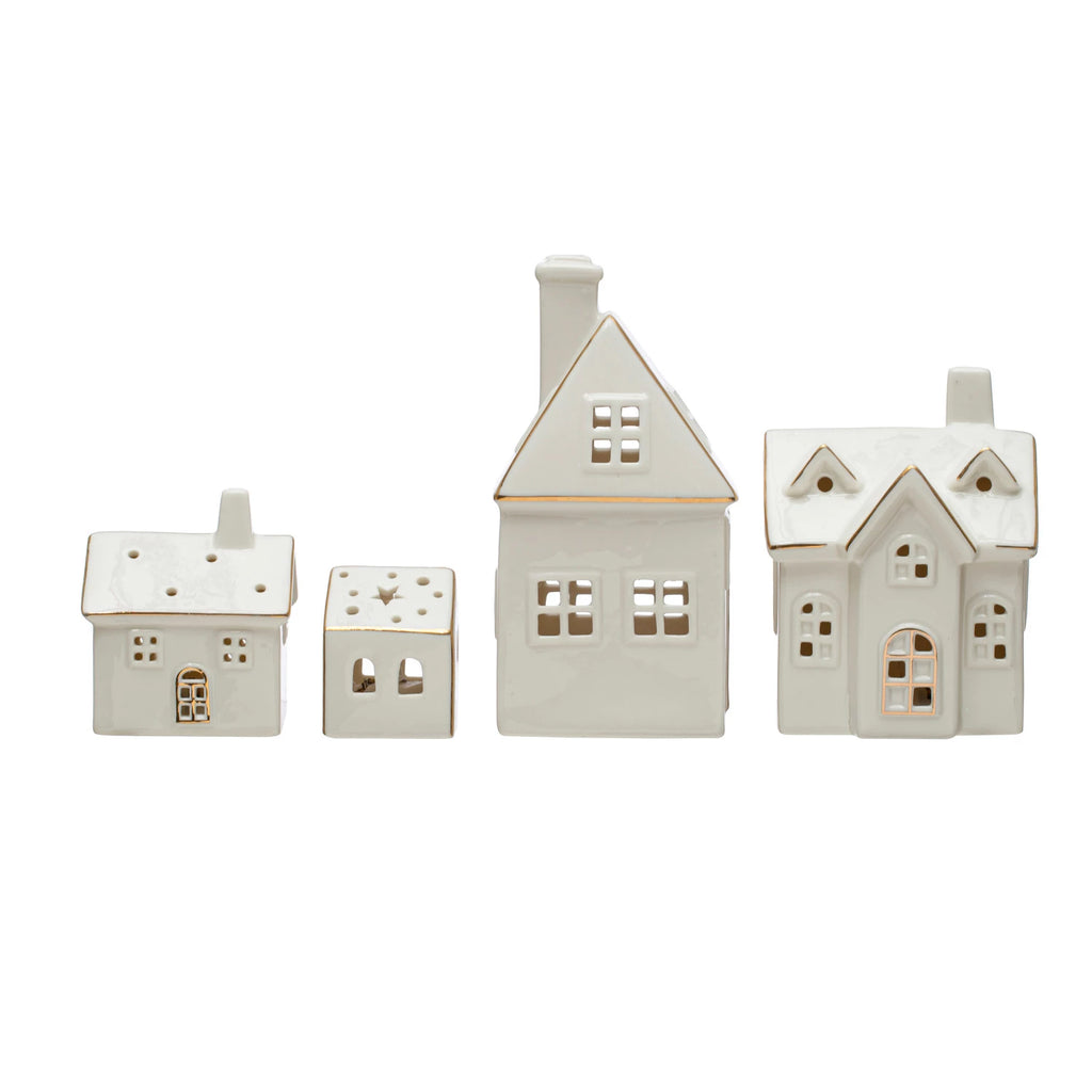 ceramic houses with  gold detailing on a white background