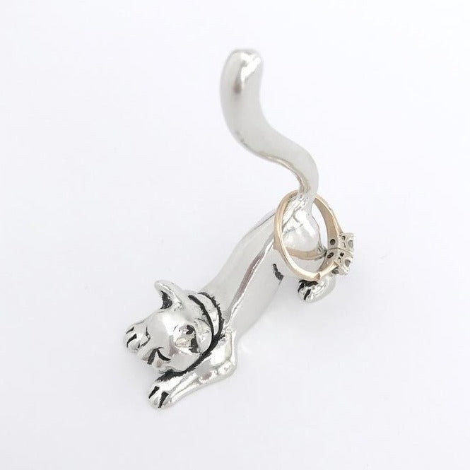 Cat Stretching Ring Holder with ring on in silver on white background