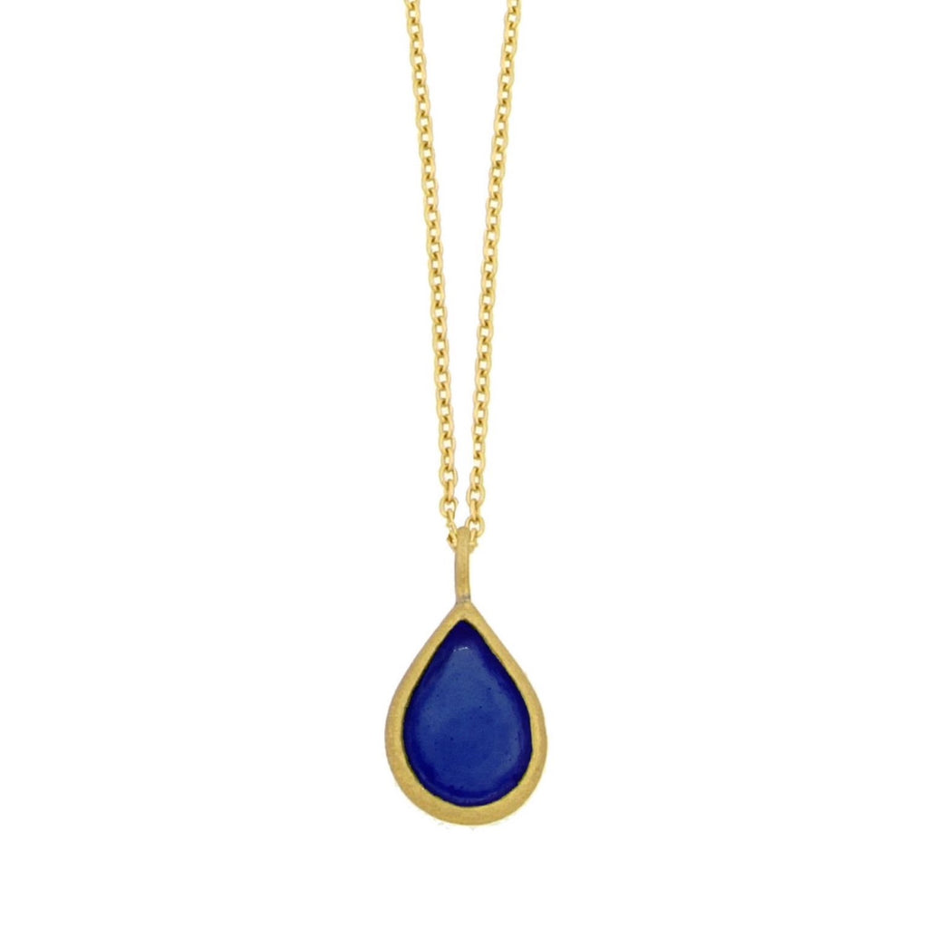 A gold-plated necklace with a bronze tear drop-shaped pendant featuring a blue cast glass element.