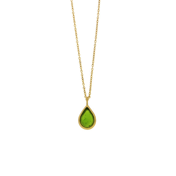 A gold-plated necklace with a bronze tear drop-shaped pendant featuring a green cast glass element.