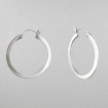Flat Medium Hoop Earring in silver on gray background