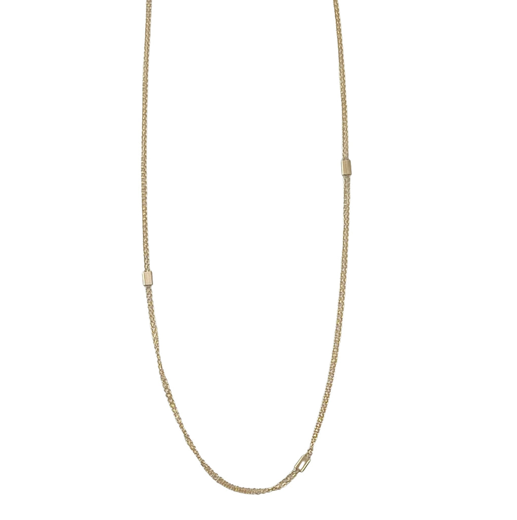 A 14k gold necklace featuring two strands of cable chain interlinked with gold tabs, displayed against a white background.