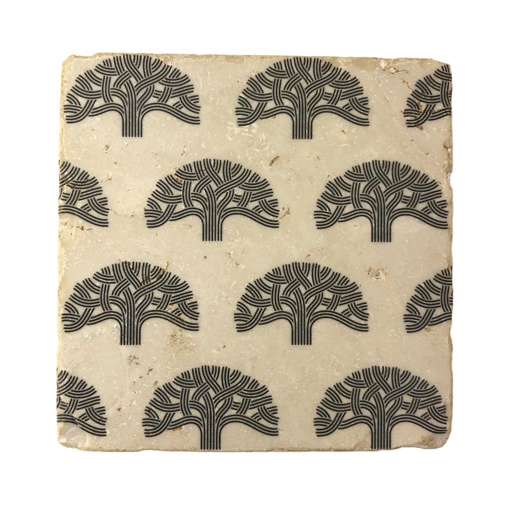 A square marble coaster with a tree pattern printed in black on its surface.