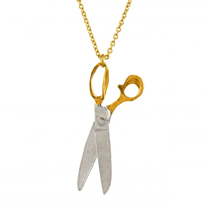 shearing scissors necklace close up on pendant over white background